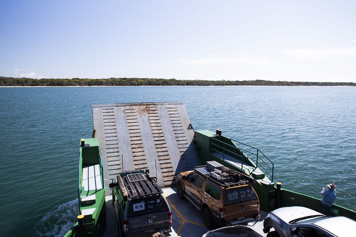 Two vehicles being transported over water