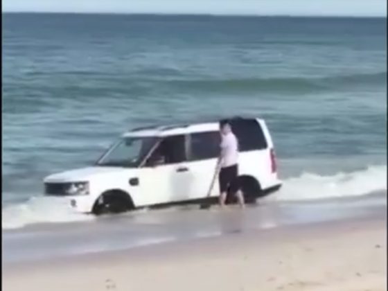 Land Rover Discovery bogged on the beach