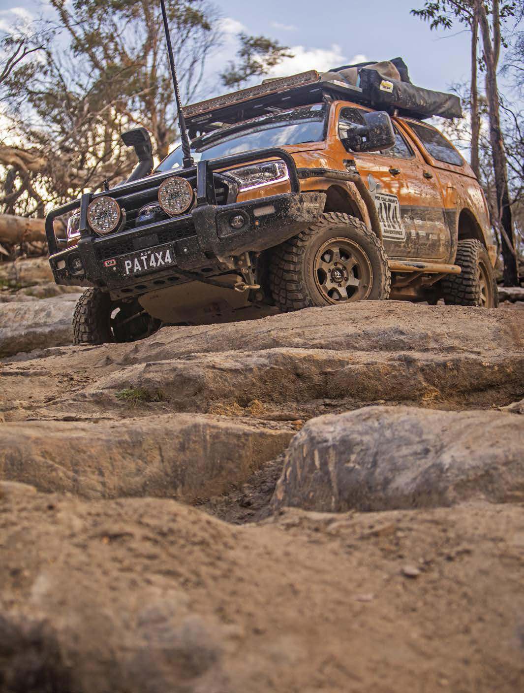 Ford Ranger climbing over a rocky ledge
